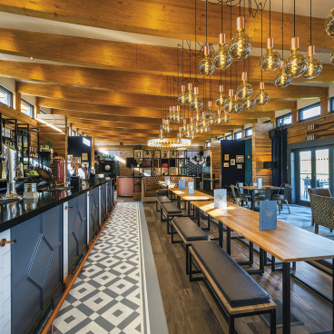 Stylish interior of The Muddy Oar in Stratford-Upon-Avon, featuring nautical decor and Karndean designs.