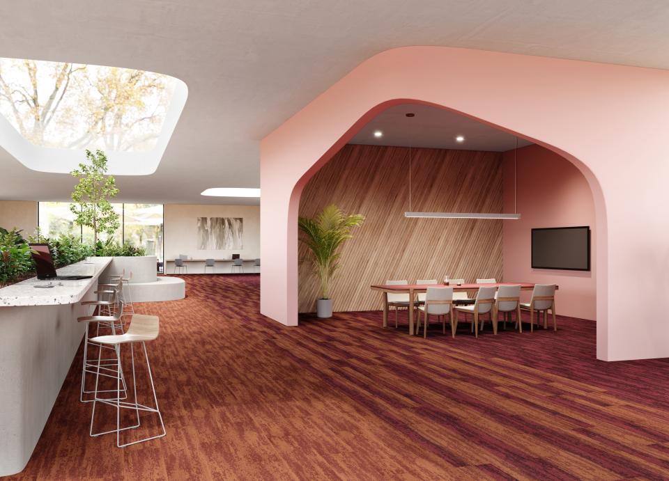 Modern workspace featuring IVC Commercial's Rudiments carpet tiles, stylish seating, and vibrant design elements for a productive environment.