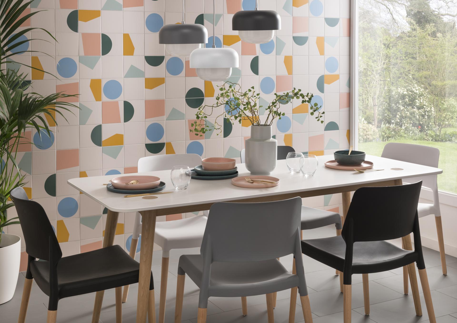 Contemporary dining room featuring Tom Pigeon tiles, a modern table set, and stylish lighting fixtures.