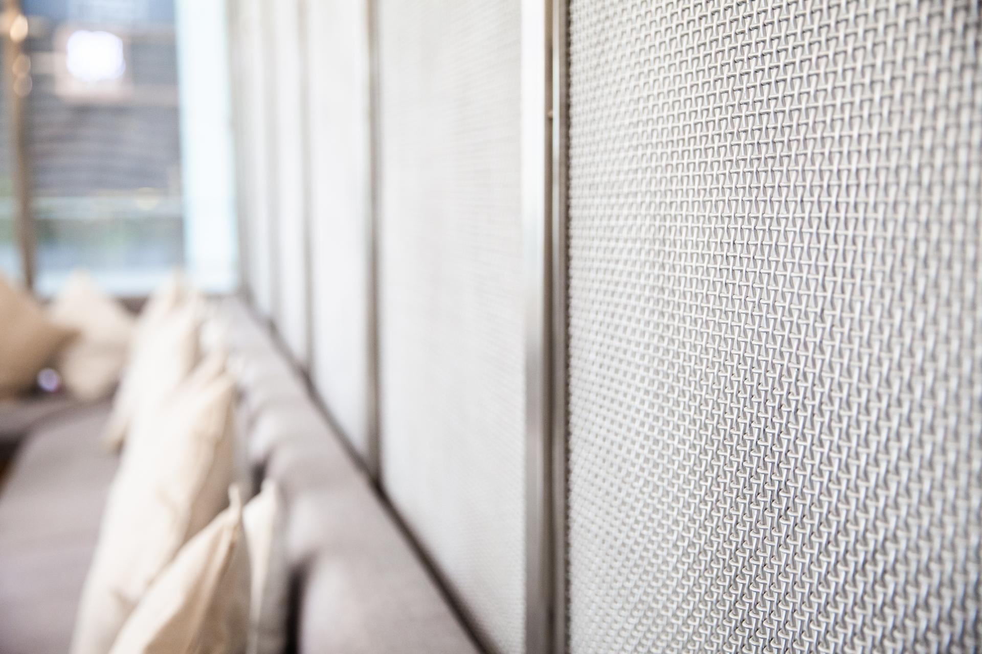 Elegant interior design featuring textured wall panels and cozy seating at the new Chunk dessert location in Riyadh.