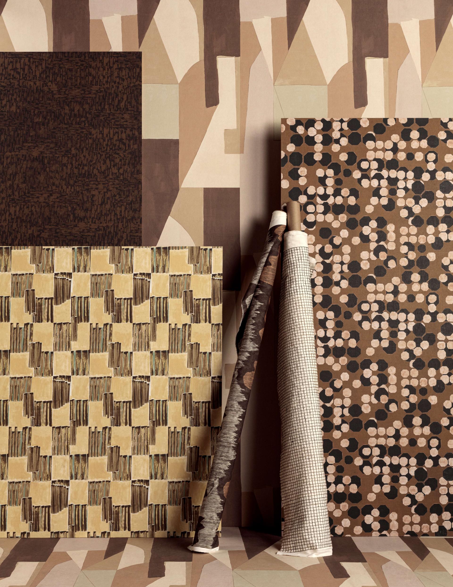Textured fabric samples featuring earthy tones and geometric patterns from the Lee Jofa and Kelly Wearstler collection.