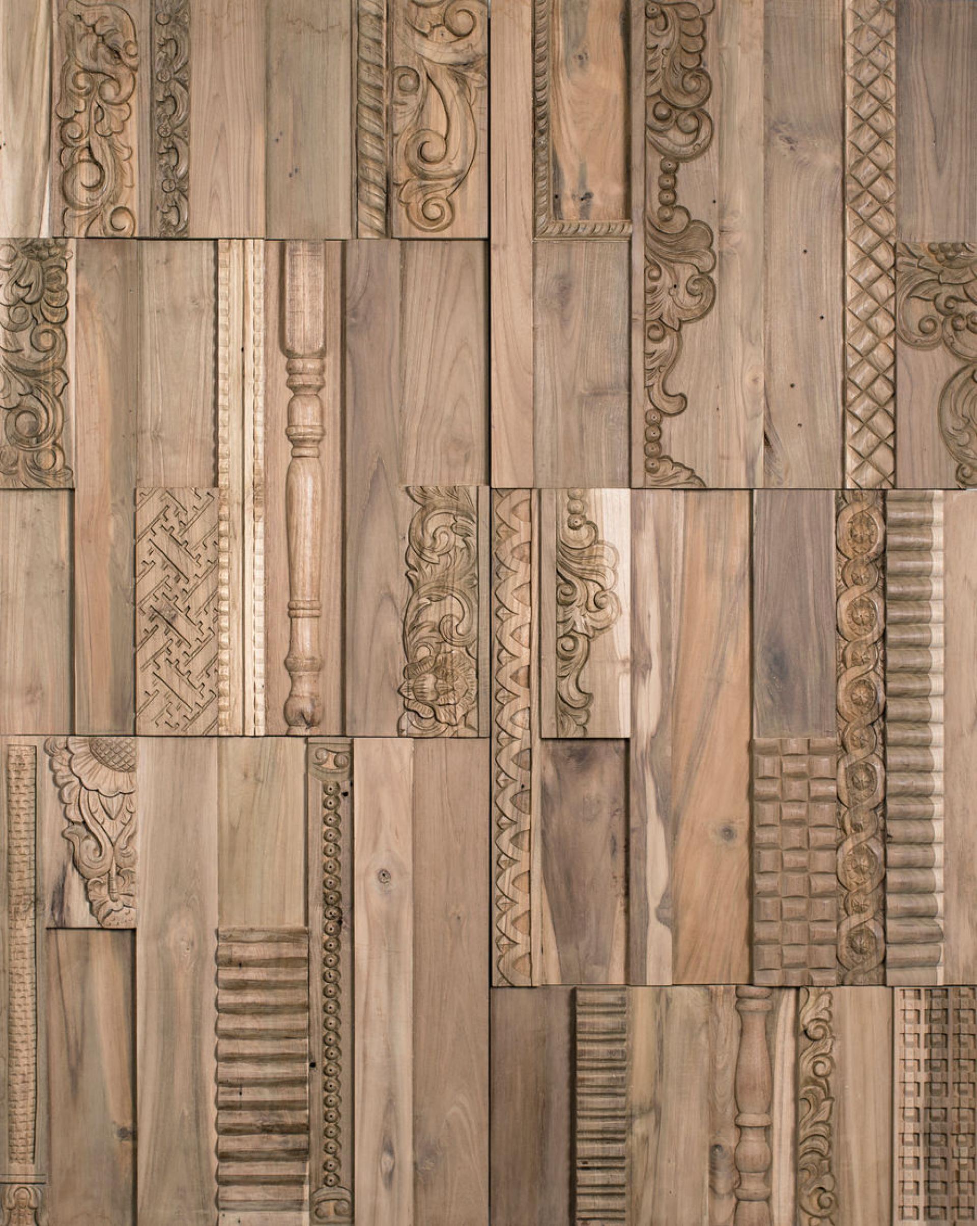 Intricately carved wooden panels showcasing diverse surface design patterns at the Surface Design Show 2022 in London.