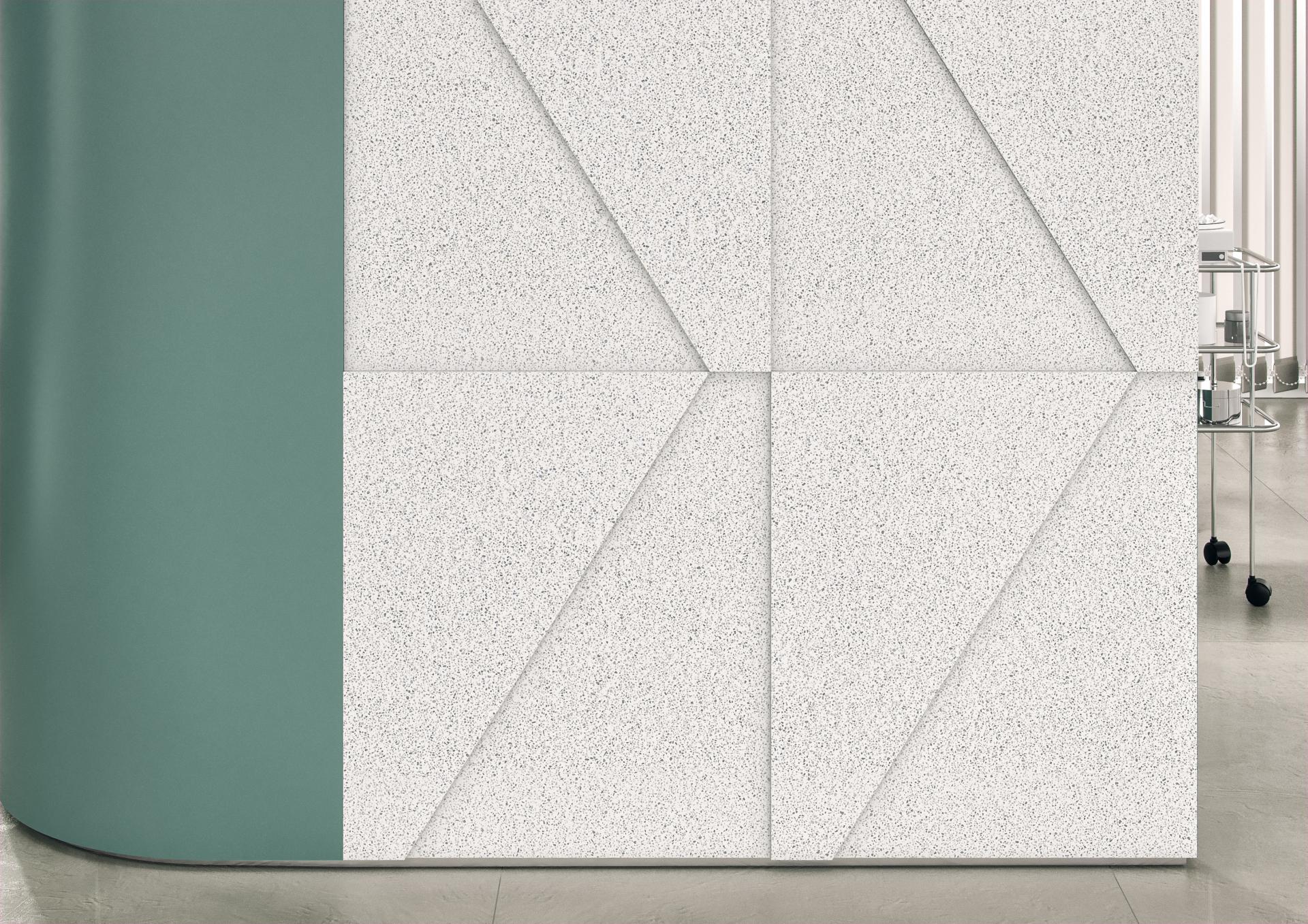 Textured white Corian® surface panel with geometric design juxtaposed against a smooth green accent, showcasing modern aesthetics.