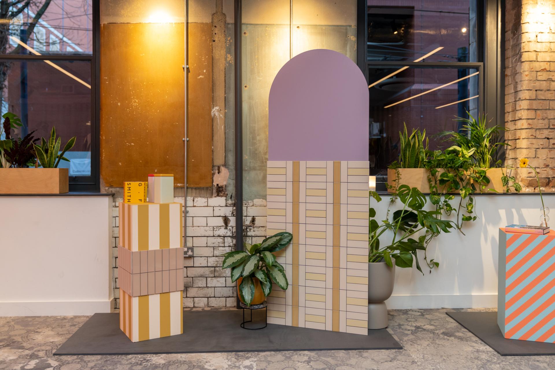 Playful color palettes and tile combinations featured in the Färgblock collection display at Material Source Studio.
