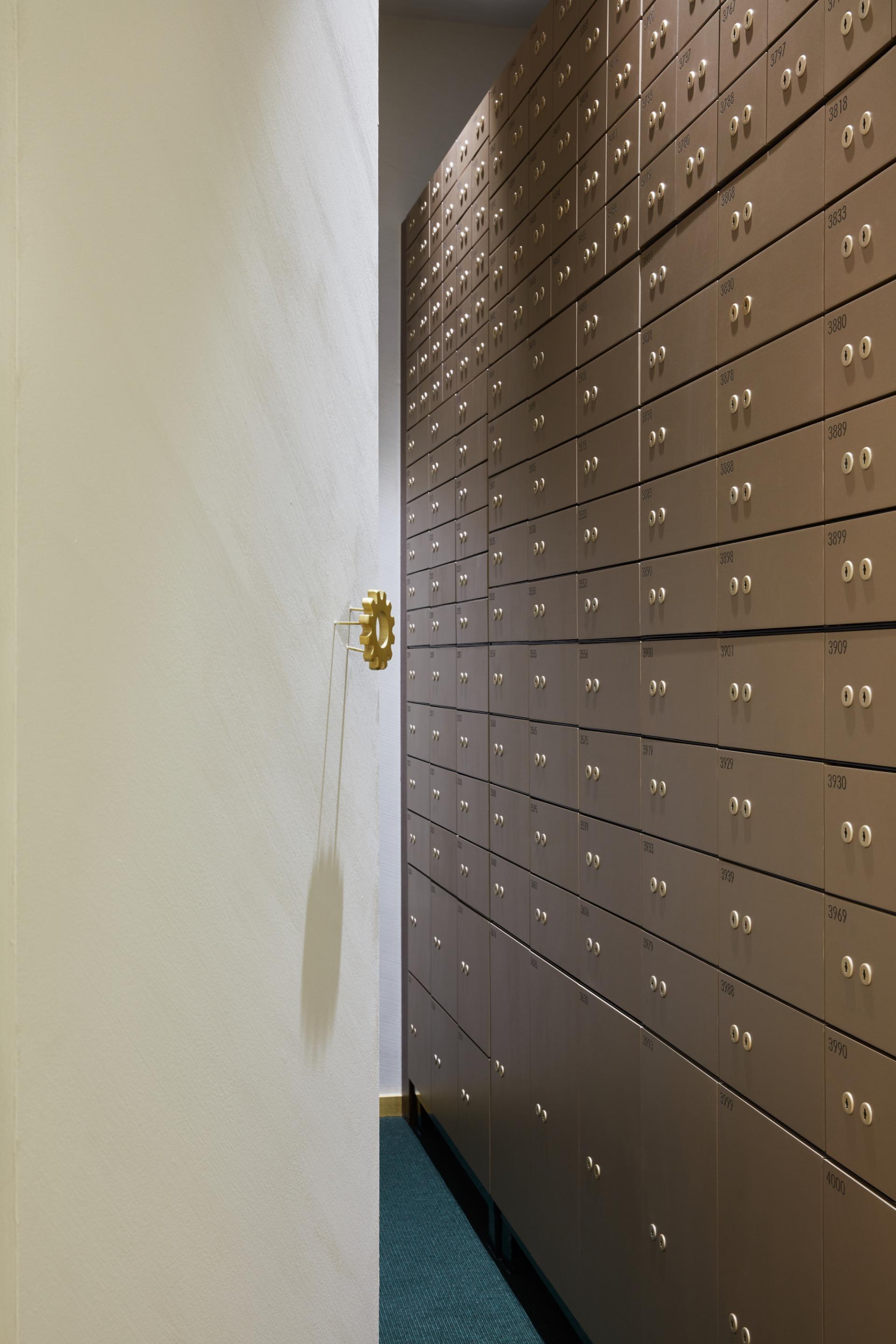 Modern rental deposit boxes line the wall in Roar’s new Vintage Vaults in Dubai, showcasing sleek design and security features.